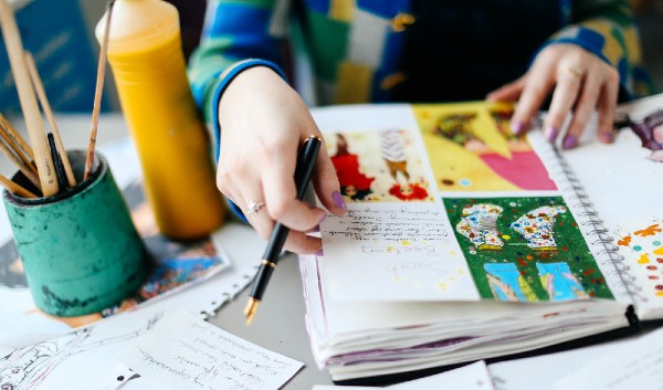 student with sketchbook